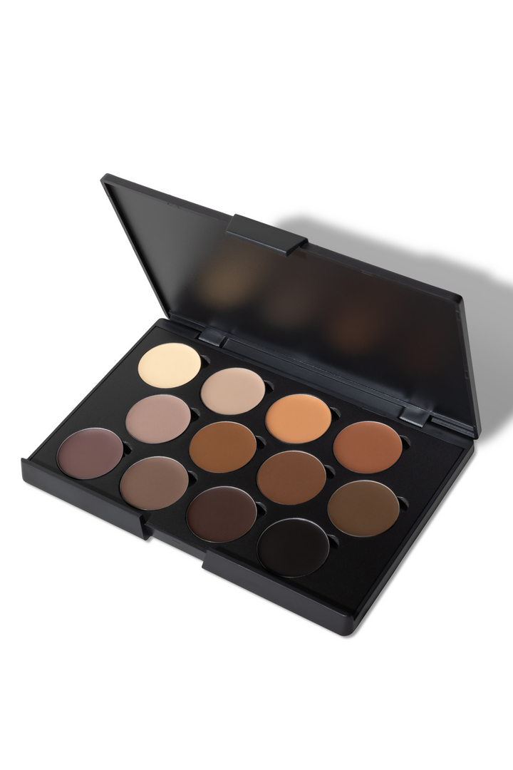 Open black makeup palette displays twelve shades of brown foundation.